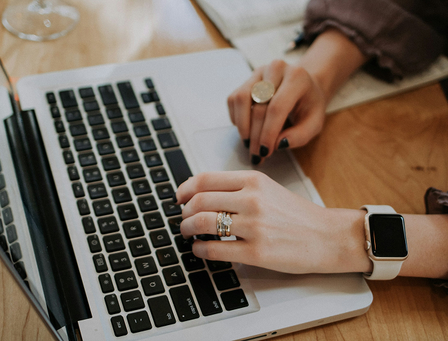 Hands on laptop keyboard