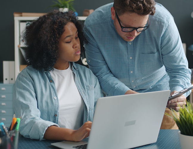 Man and woman looking at tablet